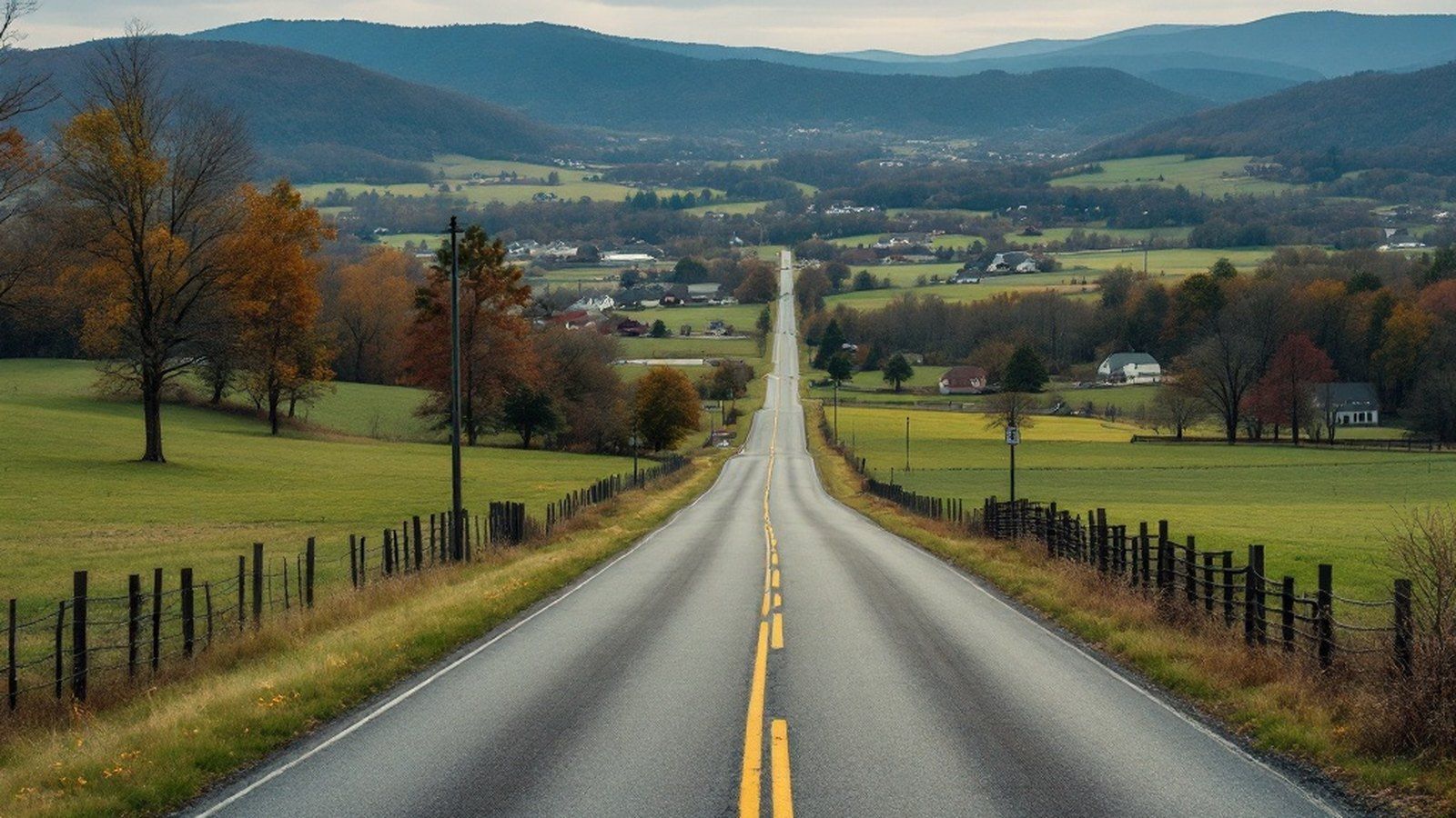 Wide-angle editorial photo of a rural Pennsylvania road with ridge and farmland